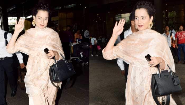 Kangana Ranaut gives desi vibes at airport; flying kisses, hand waves make for a pap-friendly outing—Photos