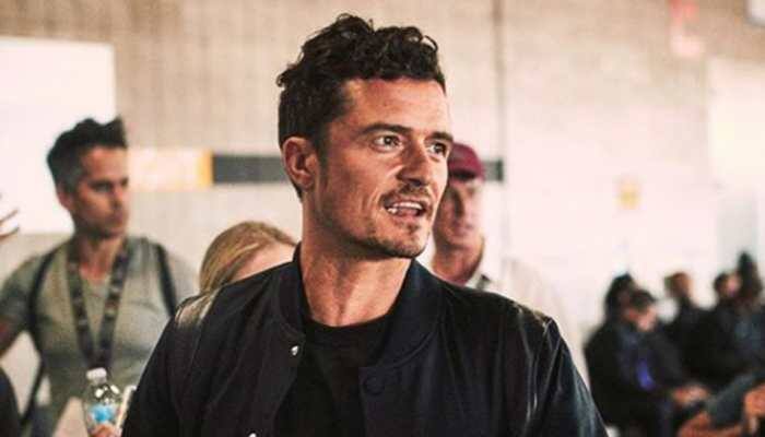 Orlando Bloom felt 'awkward' filming steamy scenes with Cara Delevingne