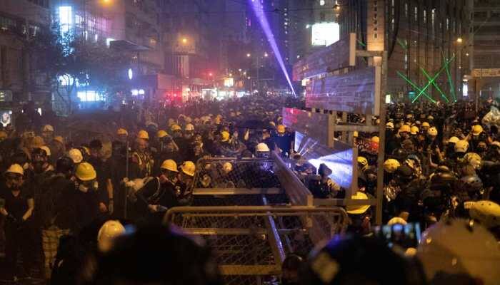 Hong Kong commercial centres paralysed as protesters, police exchange petrol bombs and tear gas