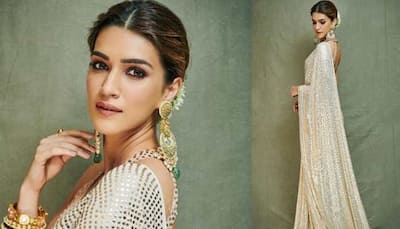 Kriti Sanon looks beautiful in a sequin saree for Ganesh Chaturthi celebrations—Pics