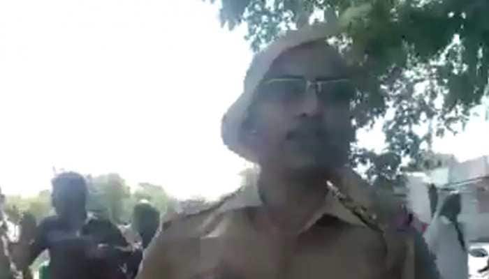 Tamil Nadu cop rescues snake from roadside tree, video goes viral Tamil Nadu cop rescues snake from roadside tree, video goes viral