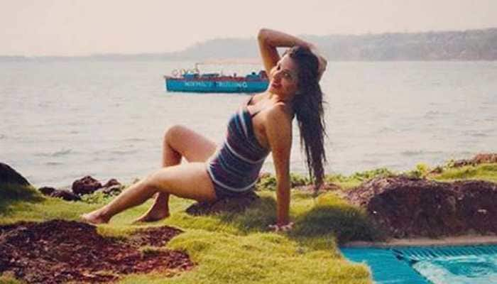 Monalisa chills by the pool in a swimsuit, shares pic- See inside