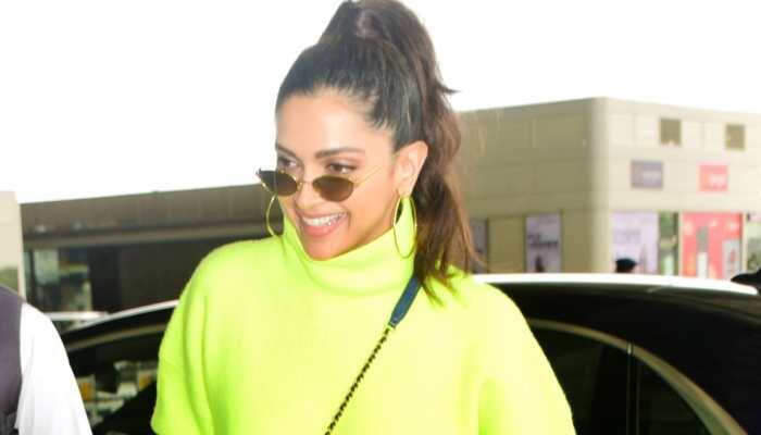 Deepika Padukone turns heads in a neon outfit at the airport—Pics