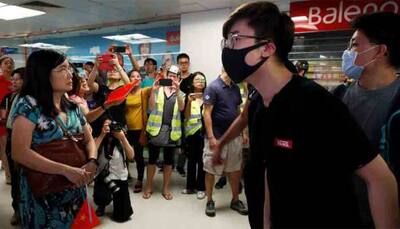 Pro-Beijing groups tear down Hong Kong's protest walls, raising risk of clashes