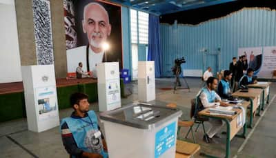Afghanistan voters defy attacks, delays to vote for president