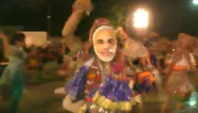 Watch: People wear PM Modi masks while performing garba in Surat