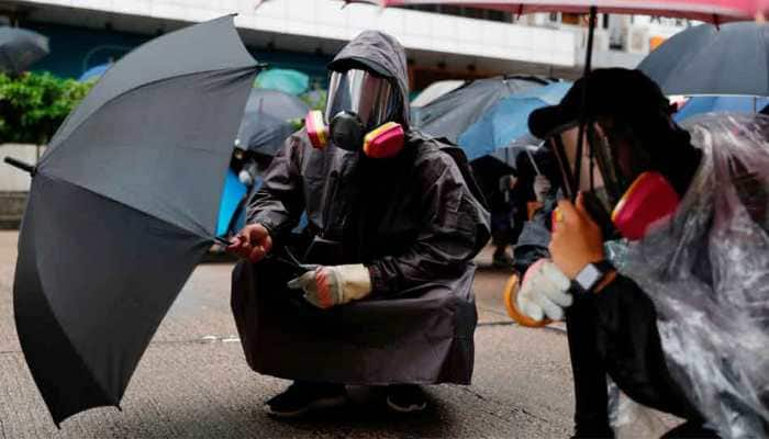 Thousands defy anti-mask law and march in Hong Kong