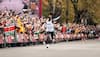 Kenya's Eliud Kipchoge becomes 1st athlete to finish marathon in under two hours 