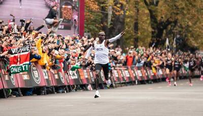 Kenya's Eliud Kipchoge becomes 1st athlete to finish marathon in under two hours 