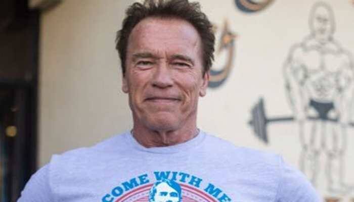 Arnold Schwarzenegger admires Tim Miller