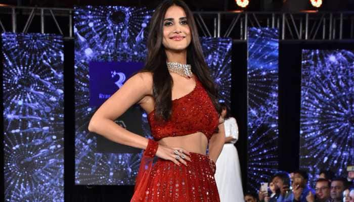 Belle of the ball! Vaani Kapoor walks the ramp in a red lehenga—Pics
