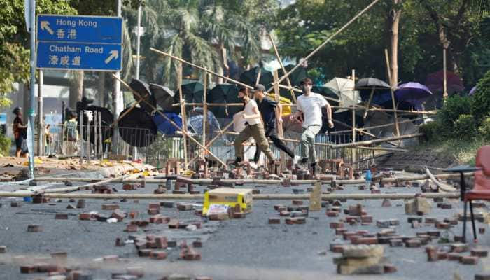 Hong Kong campus holdouts desperately seek escape routes