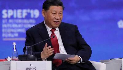 China's President Xi Jinping says he wants to work out initial trade deal with US