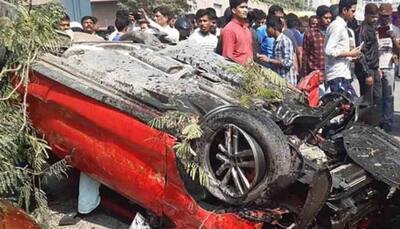 Speeding car falls off Hyderabad flyover, woman pedestrian crushed — Watch