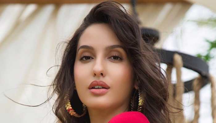 Nora Fatehi looks stunning in red; picture goes viral | People News | Zee  News