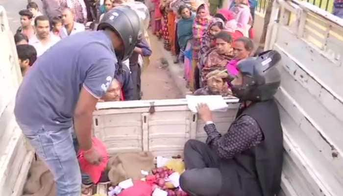 Fearing stampede, Patna officials wear helmets while selling onion for Rs 35/kg