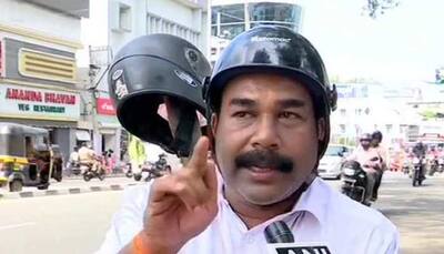 Shiv Sena leader protests fines against violation of helmet rules in Kerala
