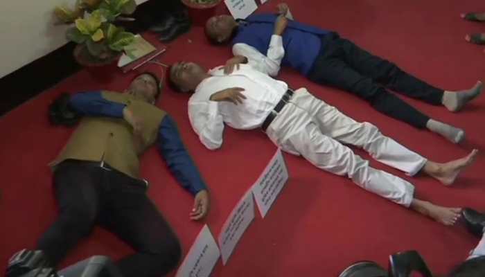 Assam Congress MLAs lay on ground inside Assembly premises to protest against land policy