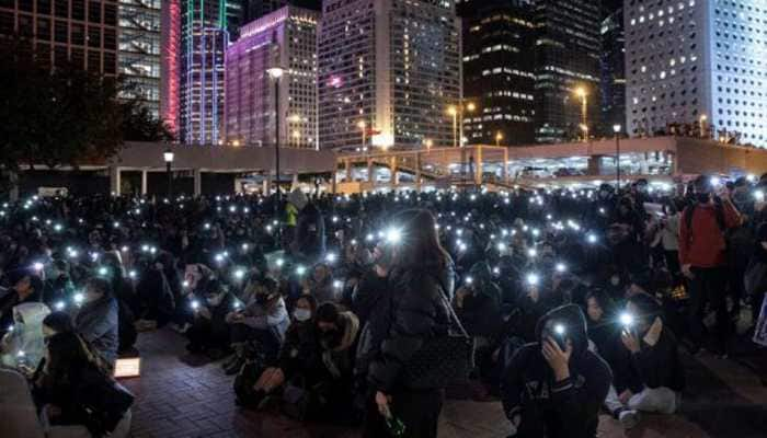 Thousands of protesters throng streets of Hong Kong as government urges calm