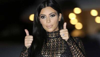 Kim Kardashian accused of photoshopping kids in family Christmas card