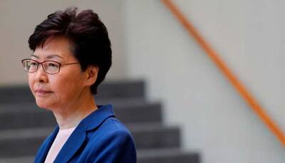 Hong Kong mall protests flare with leader Carrie Lam in Beijing