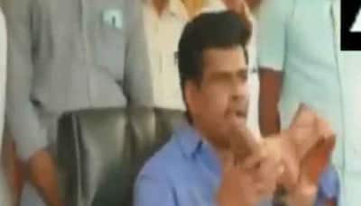 Andhra Pradesh MP licks police boots to protest remarks