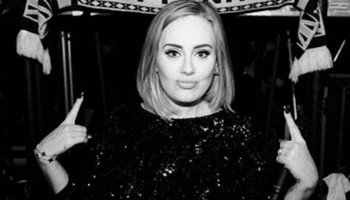 Adele looks glamorous in festive photos after weight loss