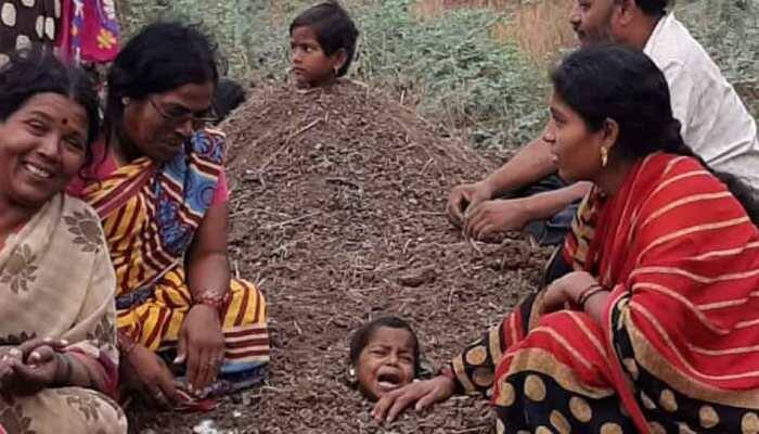 During Solar Eclipse disabled children buried neck-deep in sand at Kalburgi