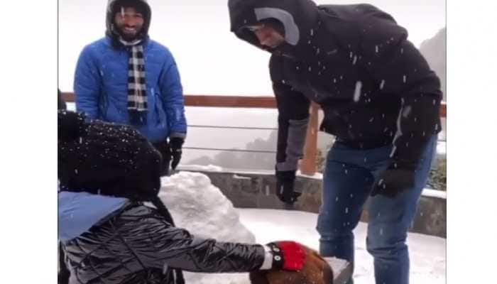 MS Dhoni builds a snowman with daughter Ziva at picturesque hill station--Watch 