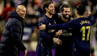 Late Nacho header takes Real Madrid top of La Liga