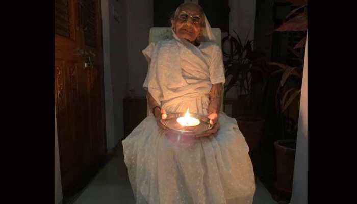 PM Modi's mother joins nation by lighting diya to mark fight against coronavirus COVID-19 PM Modi's mother joins nation by lighting diya to mark fight against coronavirus COVID-19