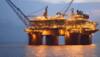Oil prices extend rebound on output cuts, still set to end tumultuous week in the red