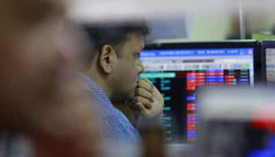 Sensex jumps nearly 1100 points mid-session, Nifty at 9,870