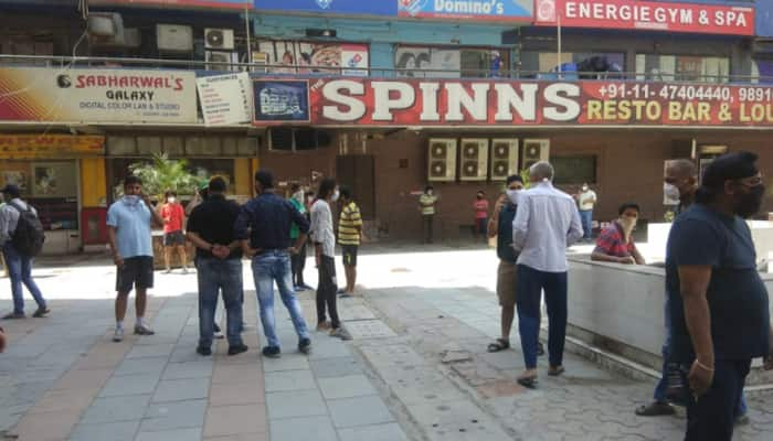 Delhi liquor shops open, thousands throng to buy, police called in