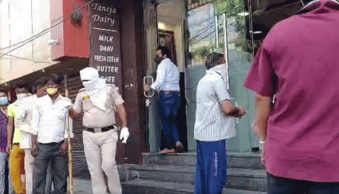 Coronavirus COVID-19 social distancing norms flouted at Delhi wine shops, police orders closure in Karol Bagh 