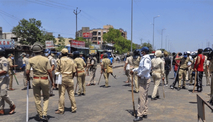 Migrants resort to violence in Gujarat's Surat, pelt stones at police, damage vehicles; 50 detained