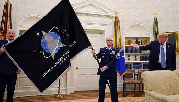 President Donald Trump unveils Space Force flag, claims US military will build &#039;super duper missile&#039;