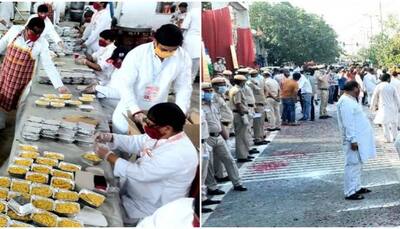Delhi police showers flowers at Jhandewalan Temple workers who have fed over 18.5 lakh people amid COVID-19 lockdown