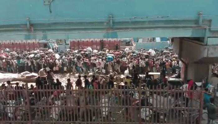 Migrant workers gather near Bandra station in Mumbai to board Shramik Special train, stopped – Watch