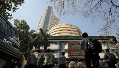 Sensex rallies over 880 points, Nifty tops 9,800 at closing