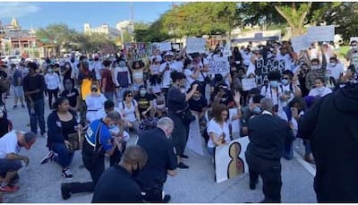 Miami Police kneel down in solidarity with George Floyd’s protesters; pics go viral
