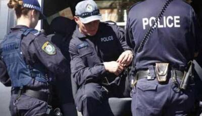 Suspect on run after two New Zealand officers shot and injured