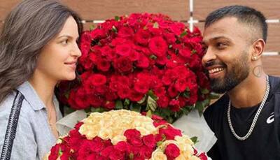Preggers Natasa Stankovic and beau Hardik Pandya soak in love with a bouquet of red roses, pics go viral!