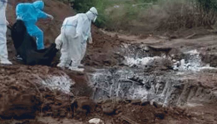 Bodies of COVID-19 victims dumped in large pit in Karnataka's Bellary, videos trigger outrage, probe ordered