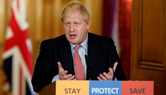 Behave yourselves, UK PM Boris Johnson warns as pubs get ready to pull pints again