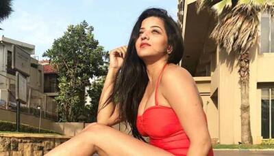 Monalisa oozes oomph in a red swimsuit and you can't blame the summer heat!