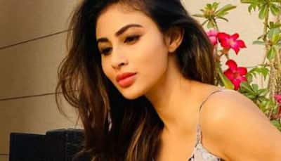 Mouni Roy oozes oomph in red bikini as she poses for some happy pics