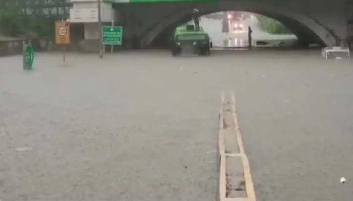 DTC bus gets stuck in waterlogged road in Delhi, passengers rescued by DFS personnel - Watch