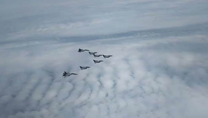 IAF Sukhoi Su-30MKIs escort Rafales as the jets move towards Ambala Air Force Station