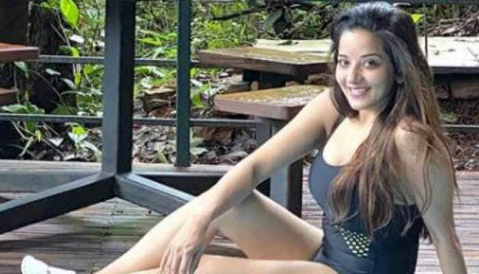 Bhojpuri bombshell Monalisa sizzles in a black monokini as she enjoys her time by the pool 